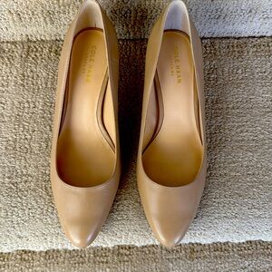 Almost new tan Cole Haan pumps with partial rubber sole and wood heel